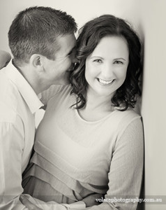 Man whispering in womans ear couples photography black and white studio Melbourne