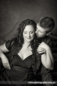 Man whispering in womans ear couples photography black and white studio Melbourne