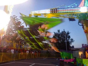 Kids fun screaming on amusement park ride Frankston festival of Lights