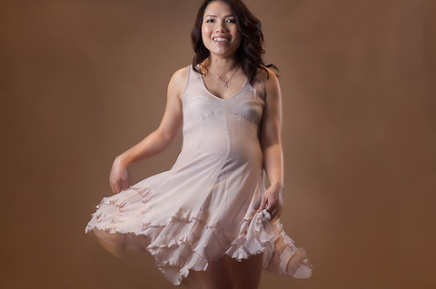 Happy Pregnant woman dancing Maternity photos