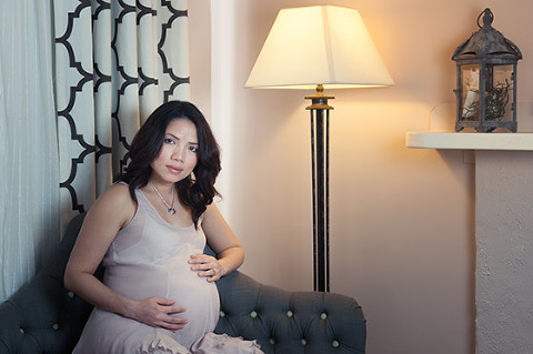 Pregant woman resting on couch Maternity photos