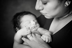 Mum and newborn photography baby holding mums hands