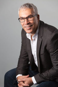 Casual professional headshot of man in suit