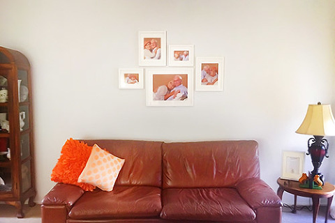 Framed photos of mature couple on wall in home studio photography in Melbourne