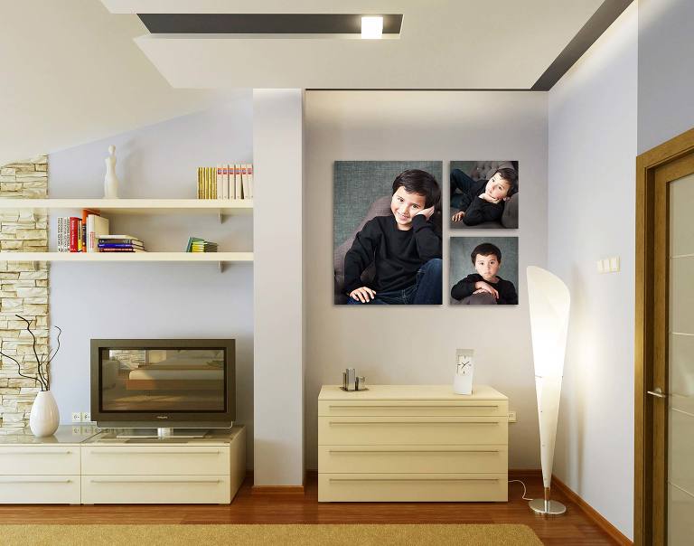 Canvas portraits of kid on wall of home