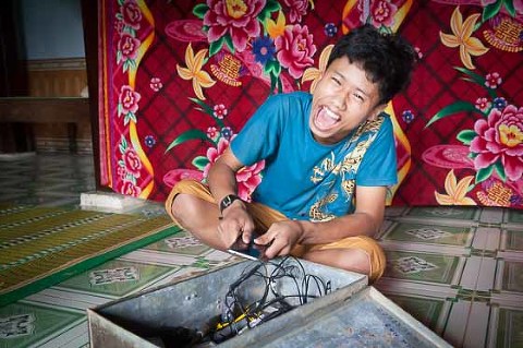 Inside a family home of child with hearing loss in Nam Dong province Hue Vietnam OGCDC village life community laughing happy