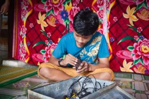 Inside a family home of child with hearing loss in Nam Dong province Hue Vietnam OGCDC village life community fixing Samsung S7