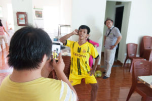 Posing for photos fun time at The Organic Farm for Youngster with disabilities in Nam Dong OGCDC