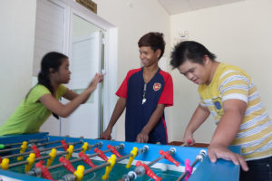 Resting and playing children at The Organic Farm for Youngster with disabilities in Nam Dong OGCDC