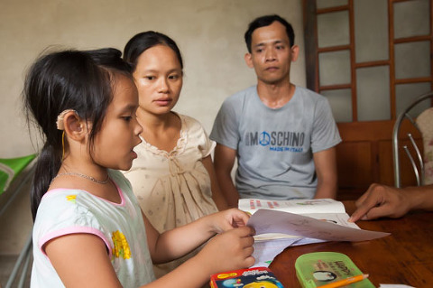 Speach therapy with young girl with hearing aids in Vietnam OGCDC