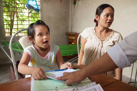 Young deaf girl learning speech program Vietnam OGCDC