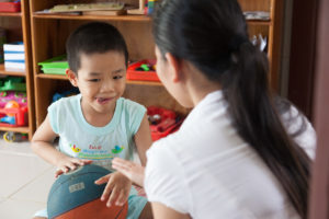A shy boy with learning disability trying to interact Early Intervention Centre Nam Dong