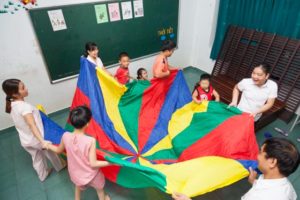 Kids and teachers having fun at the future school in Hue