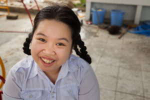 happy young girl loves the camera