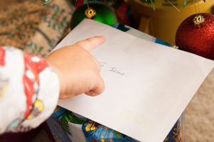 christmas card and present with boys name on it
