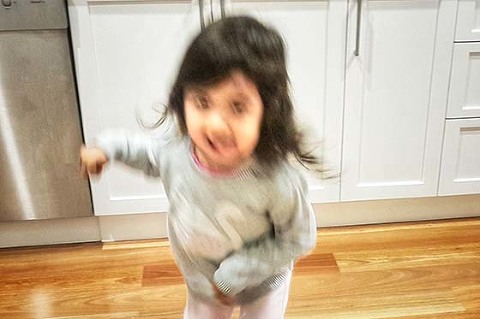 Blurry photo of child dancing