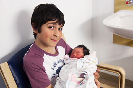Jesse holding Aria when she was 1 day old